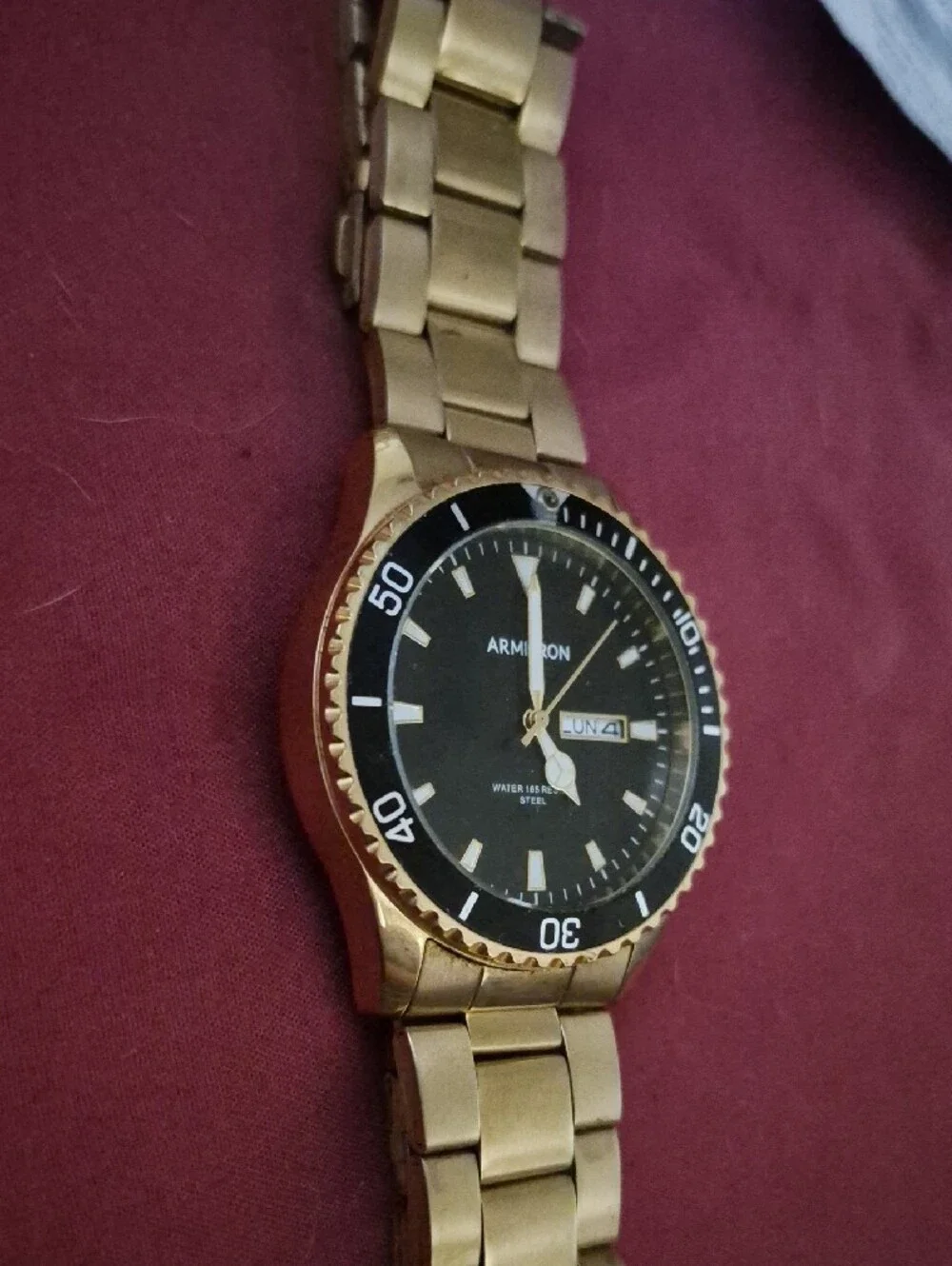 Armitron Gold-Tone Watch with Black Dial and Day-Date